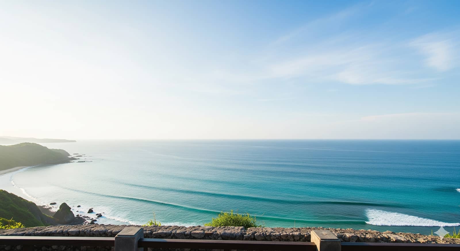 Tropical cliff viewpoint over turquoise ocean with open sky